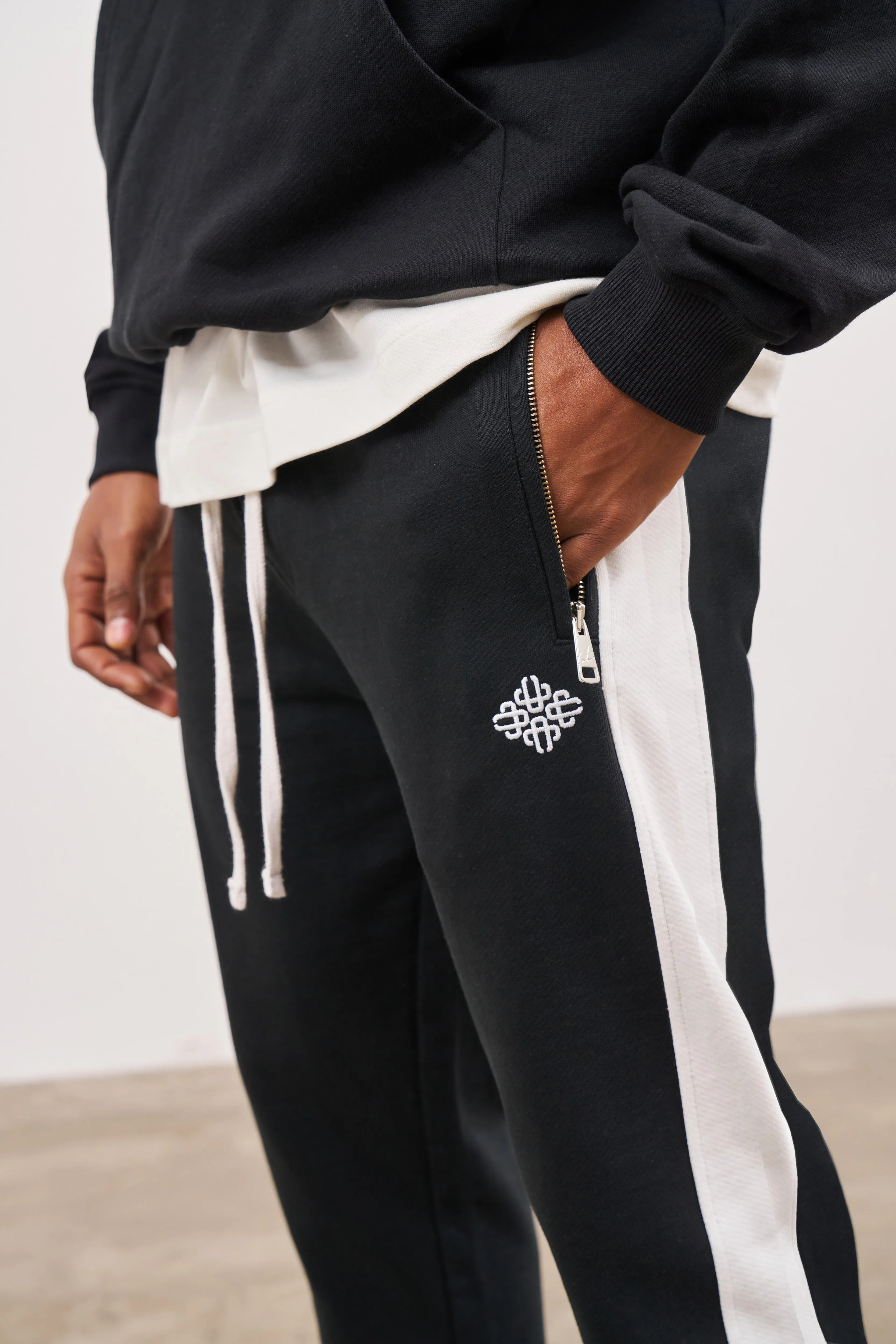 EMBLEM SIDE PANEL SPLIT HEM JOGGERS - BLACK