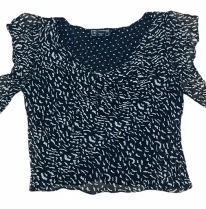 Nostalgia B/W Ruffeled Jewel Neck Blouse